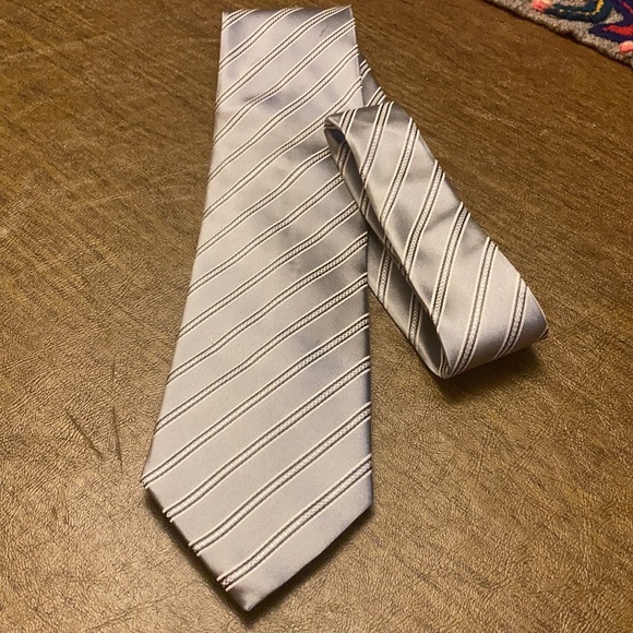 Help convince my husband to retire his more abstract ties  My husband has too many ties.